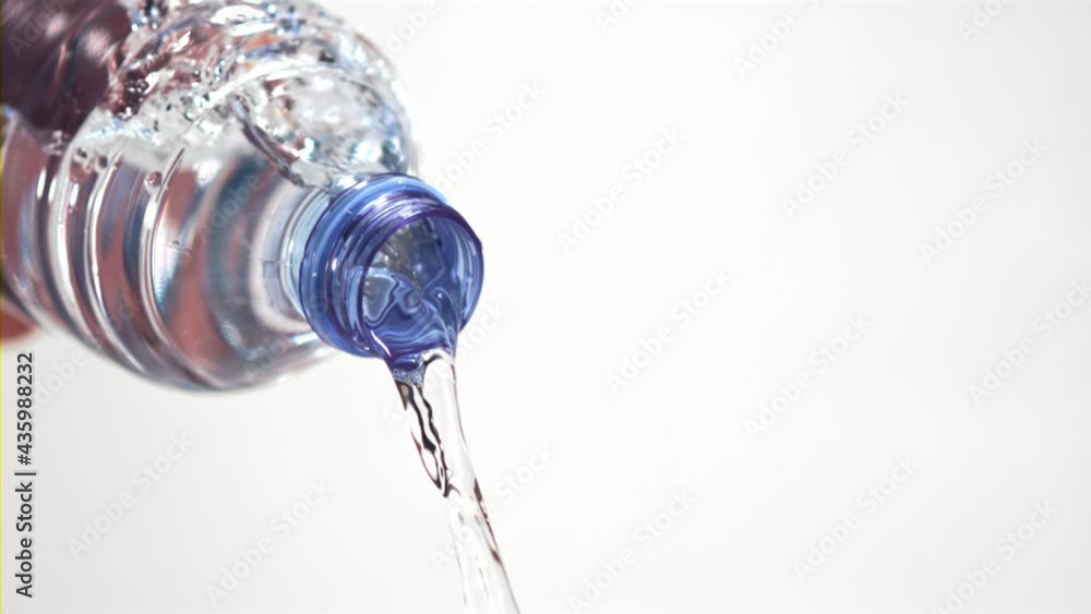 Super slow motion from the bottle pours a stream of water. On a white background. Filmed on a high-speed camera at 1000 fps. High quality FullHD footage Super slow motion from the bottle pours a stream of water. On a white background. Filmed on a high-speed camera at 1000 fps. High quality FullHD footage