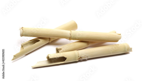 Broken bamboo sticks pile isolated on white background