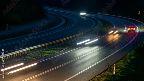 lights of moving cars at night. long exposure