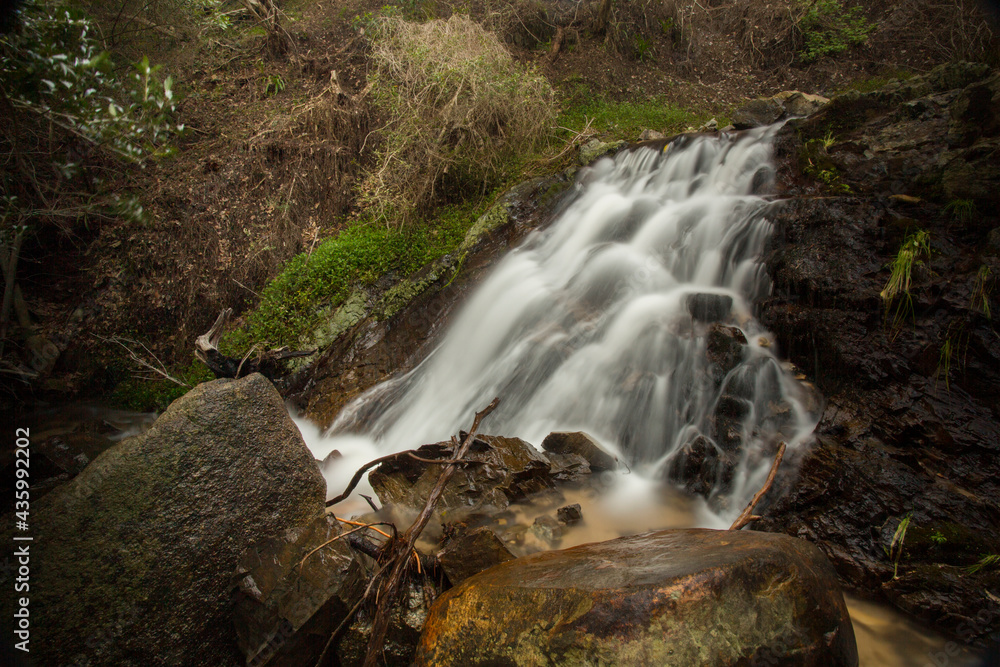 A cascading waterfall in a mountain in the Paarl Region of the Western Cape, South Africa. A cascading waterfall in a mountain in the Paarl Region of the Western Cape, South Africa.