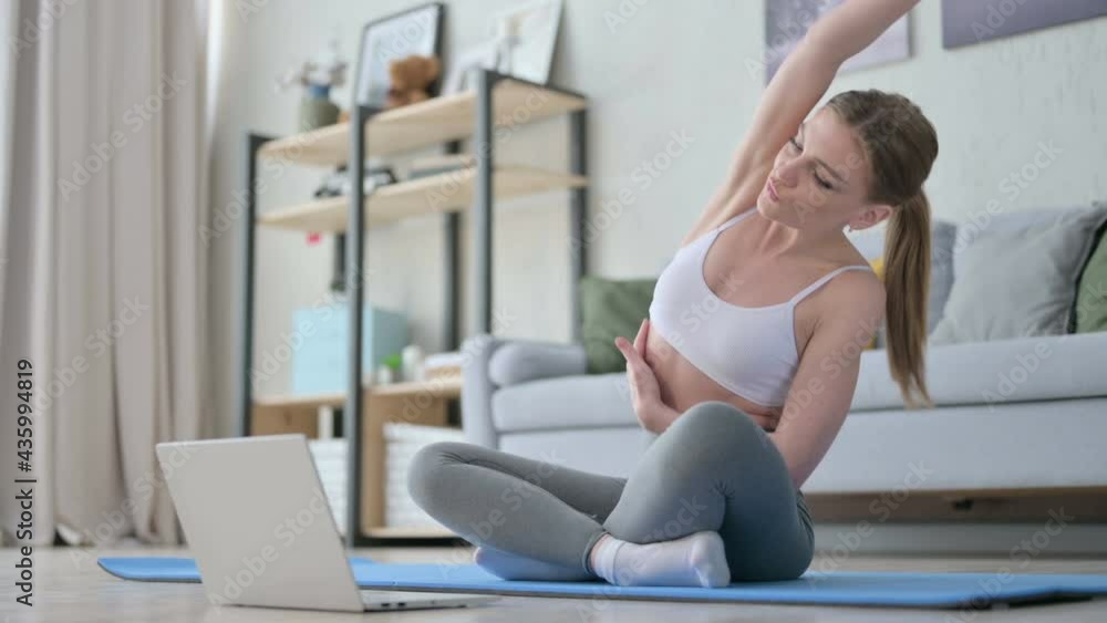 Woman doing Yoga While on Video Call on Laptop