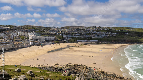 ST IVES, CORNWALL, UK - MAY 13 : View of Porthmeor beach at St Ives, Cornwall on May 13, 2021. Unidentified people © philipbird123