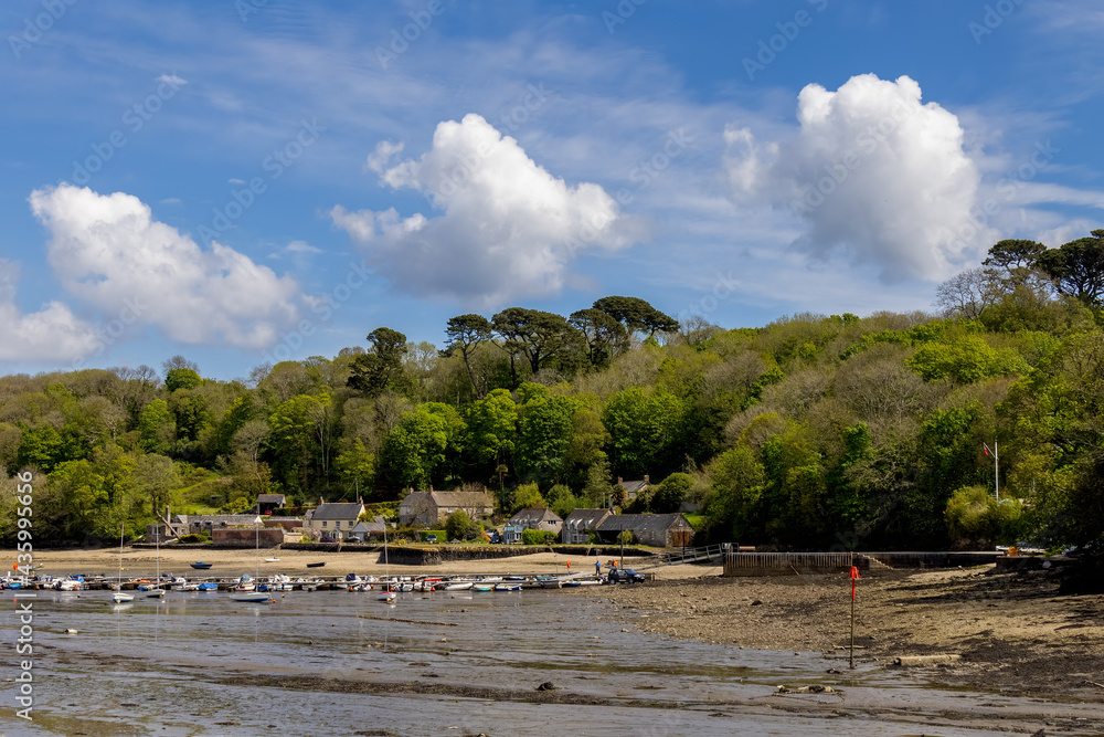 HELFORD, CORNWALL, UK - MAY 14 : View from Helford Creek at low tide in Helston, Cornwall on May 14, 2021. Two unidentified people HELFORD, CORNWALL, UK - MAY 14 : View from Helford Creek at low tide in Helston, Cornwall on May 14, 2021. Two unidentified people