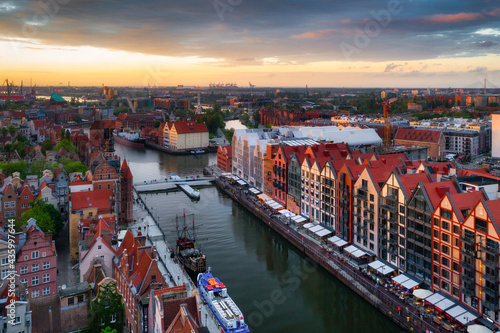 Amazing architecture of the main city in Gdansk at sunset, Poland. Aerial view of the historic Port Crane