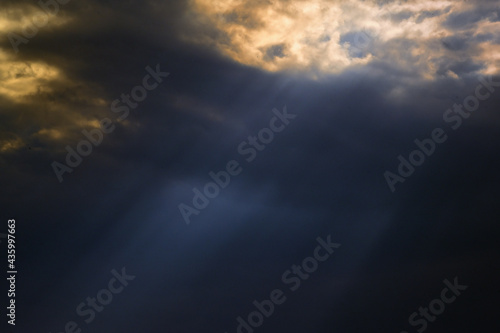 Dramatic sunset with sunrays and clouds