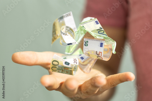 euro bills flying around  i...