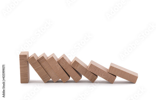 The domino effect stopped by a unique  one strong piece isolated on white with clipping path