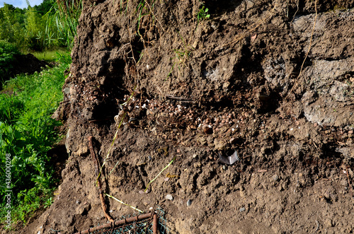 anthropocene soils with layers of waste layered in a soil probe. plastics characterize the hectic period of wild teasing and littering. photo