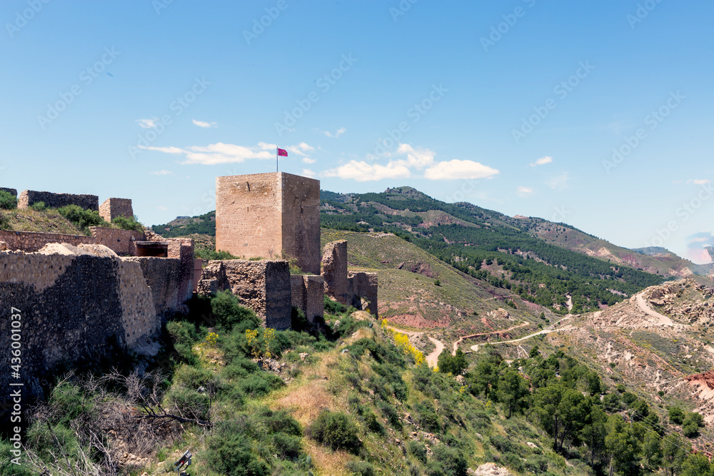 exterior view of part of the wall and tower of the medieval castle of Lorca Murcia Spain, located on top of a hill with privileged views for its defense