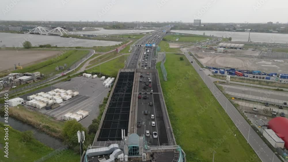 Dutch highway near Amsterdam Zeeburg A10 exit S114 and a small traffic jam aerial view. Dutch highway near Amsterdam Zeeburg A10 exit S114 and a small traffic jam aerial view.
