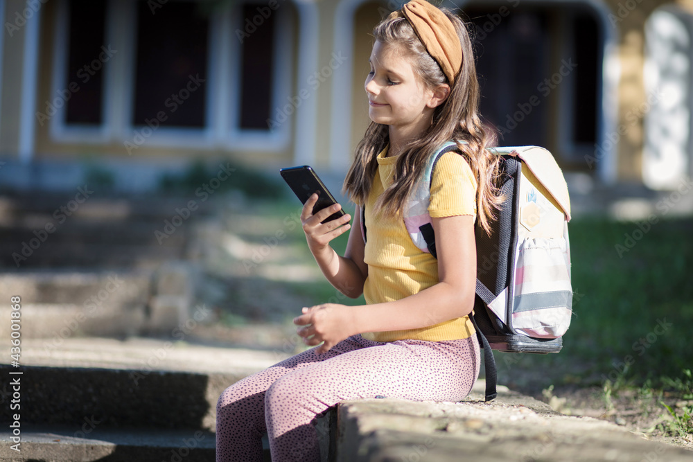 Little girl using smart phone. Little girl using smart phone.