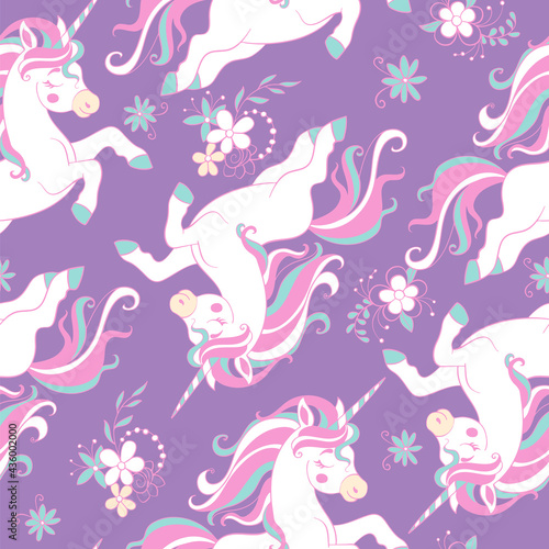 Seamless vector pattern with dreaming unicorns on purple
