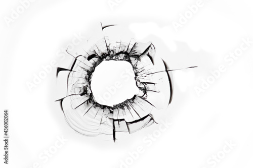 Shot hole, broken glass, cracked window, abstraction of cracked broken glass texture for design.