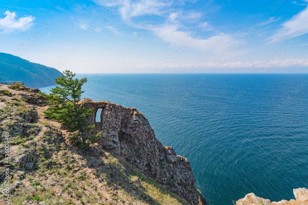 Mountain coast of Lake Baikal on a summer day. Cape Khoboy is the northernmost point of Olkhon Island. Siberia, Russia