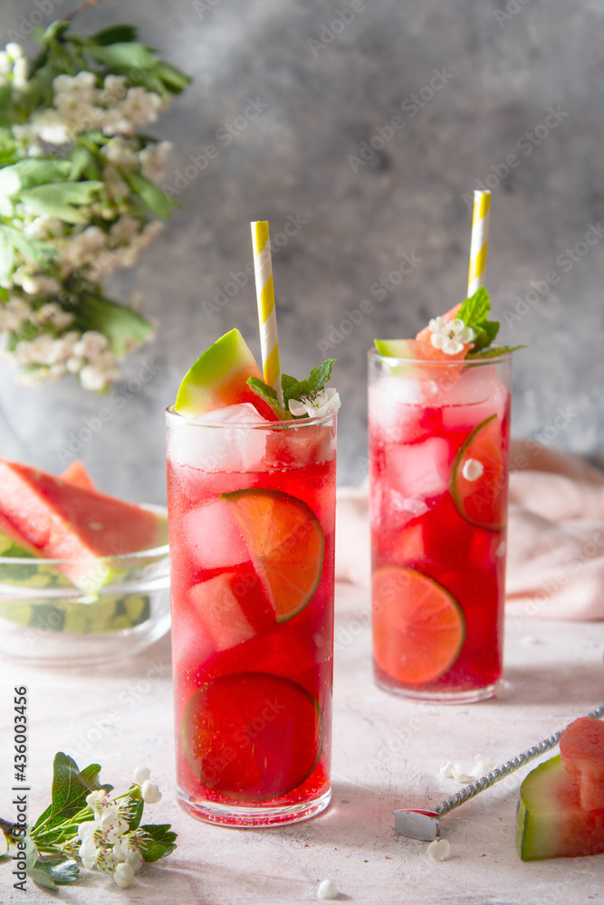 Watermelon refreshing lemonade with lime and mint. Delicious cocktail cold fruit drink. Watermelon refreshing lemonade with lime and mint. Delicious cocktail cold fruit drink.