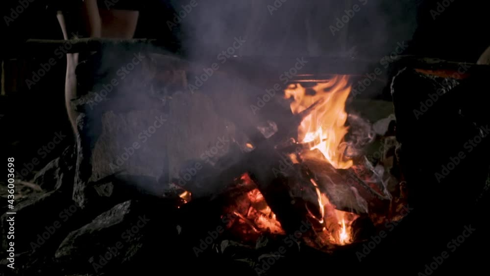 Campfire In The Night With Burning Wood And Flames - Hot Fire In The Night With Flames And Natural Firewood - close up Campfire In The Night With Burning Wood And Flames - Hot Fire In The Night With Flames And Natural Firewood - close up