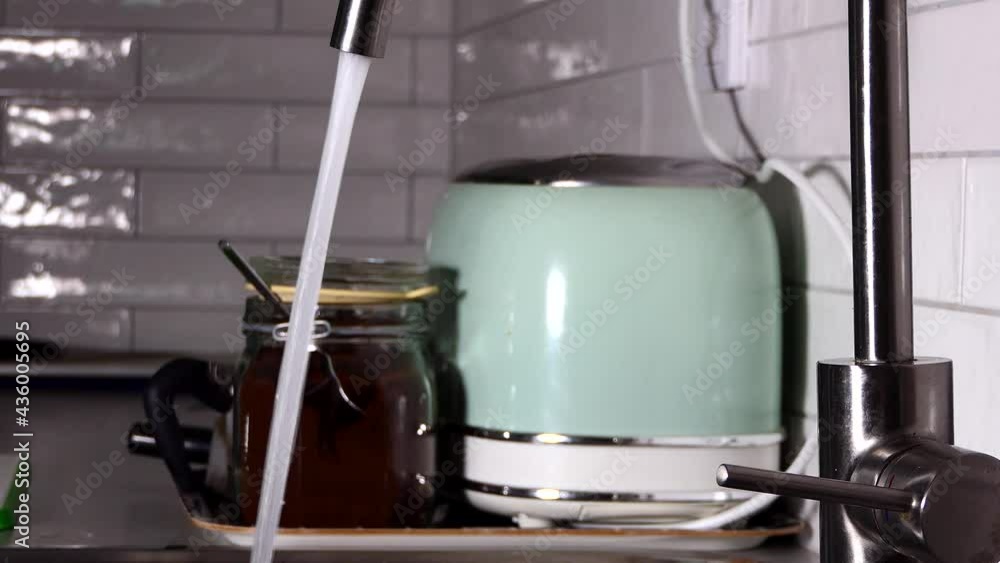 A water faucet in a kitchen A water faucet in a kitchen