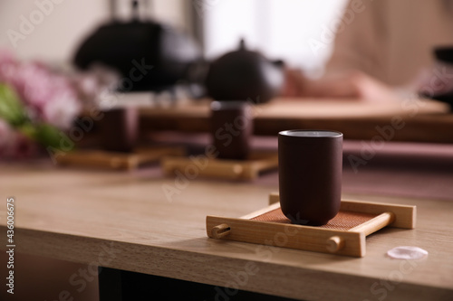 Cup for traditional tea ceremony on wooden table