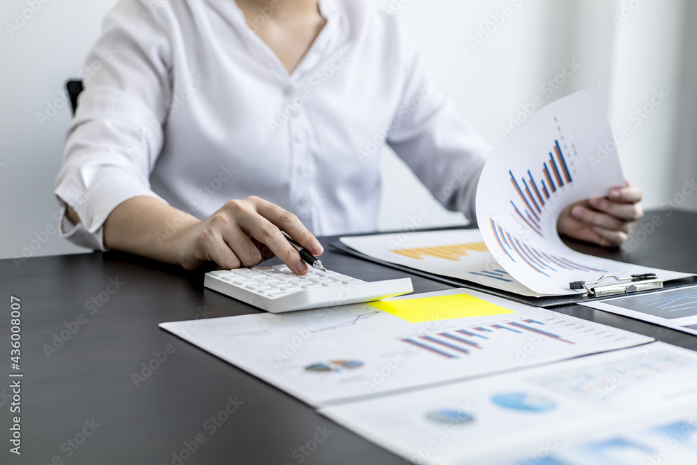 Financial accountants are checking documents from the finance department, verifying company financial figures for accuracy and not to be fraudulent. Concept of corporate financial auditing. Financial accountants are checking documents from the finance department, verifying company financial figures for accuracy and not to be fraudulent. Concept of corporate financial auditing.