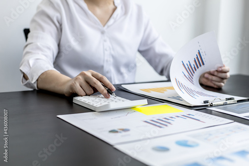 Financial accountants are checking documents from the finance department, verifying company financial figures for accuracy and not to be fraudulent. Concept of corporate financial auditing.