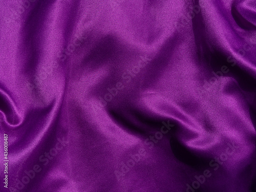 Purple silk fabric texture top view. Violet background. Fashion trendy color feminine satin dress flat lay, female blog glossy silky backdrop text sign design. Girly abstract wallpaper,textile surface