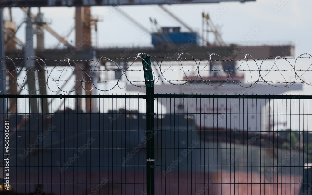PROTECTING SITE - Separating seaport with fence and razor wire
PROTECTING SITE - Separating seaport with fence and razor wire