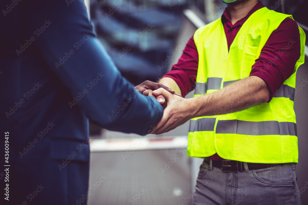 Two businessmen handshaking. Focus is on hands. Two businessmen handshaking. Focus is on hands.