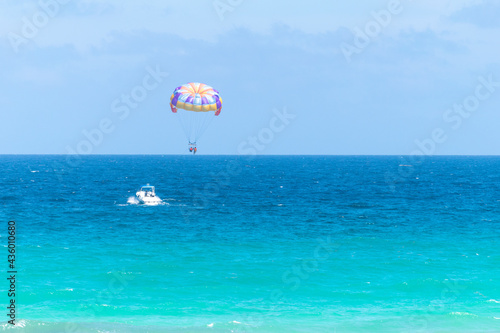 beautiful landscape with sea views and parachute boats photo