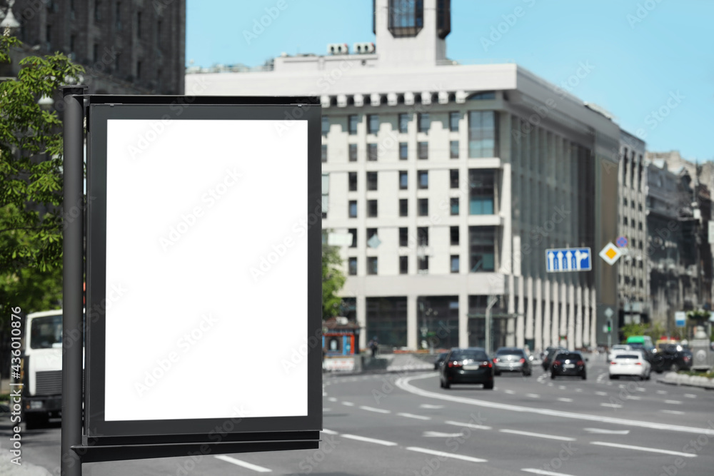 Blank advertising board on city street. Mockup for design Blank advertising board on city street. Mockup for design