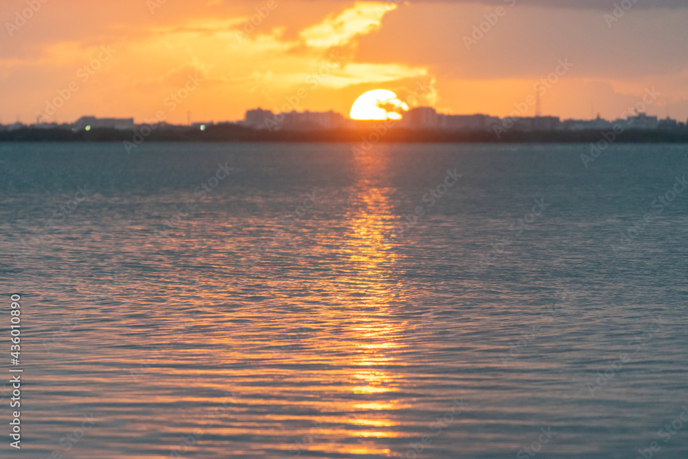 sunset reflected in sea water