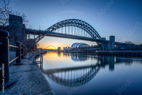 The bridges between Gateshead and Newcastle-upon-Tyne on the River Tyne with a stunning late summer sunrise. photo