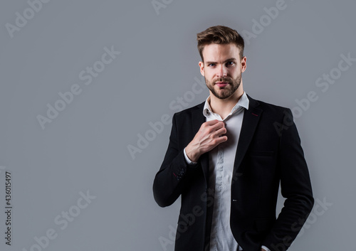 Fotografie, Obraz young handsome man in formal wear has bristle on face, businessman