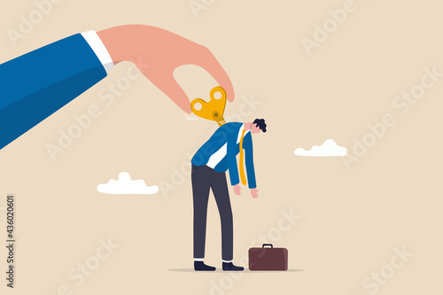 Exhausted employee recharged, power up or wind up to stimulate or motivate fatigue person concept, manager big hand turn wind up key or winder clockwork to motivate businessman office worker.