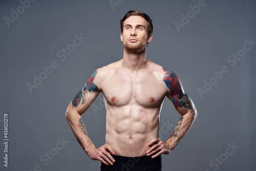 male topless muscled abs tattoo cropped workout view