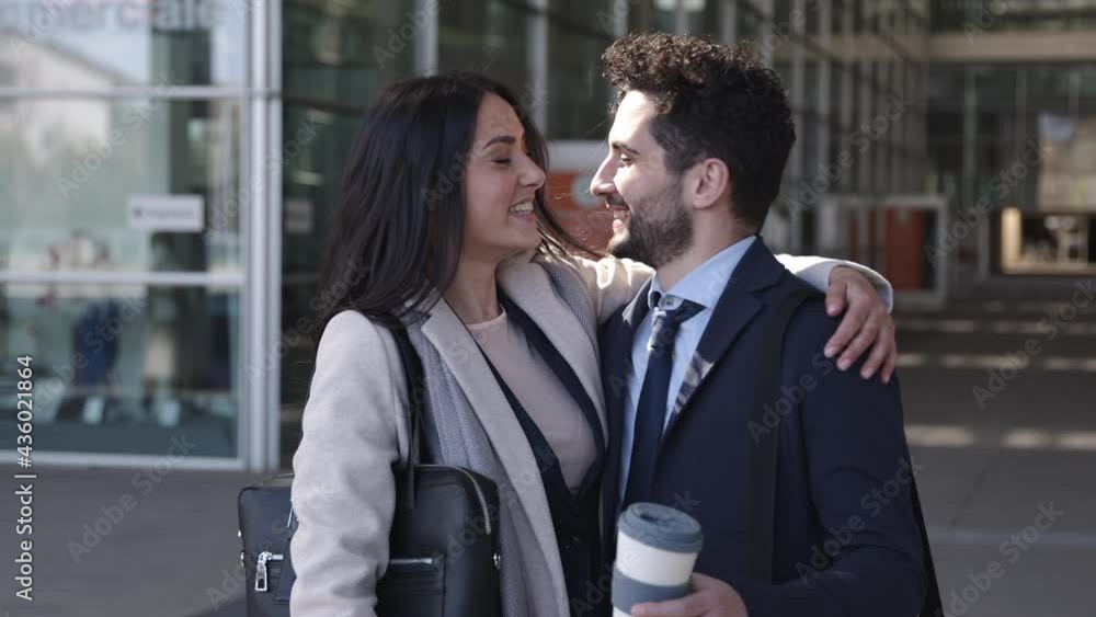 Business couple meeting in the street, kissing and taking selfie Business couple meeting in the street, kissing and taking selfie