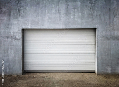Garage Door in Unfinish Exterior Concrete Wall