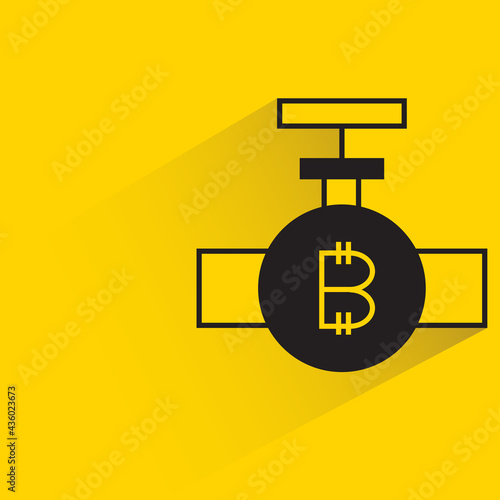 bitcoin symbol and valve icon with shadow on yellow background