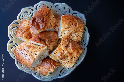 isolated photo of a traditional bread sliced and put in a white breadbasket