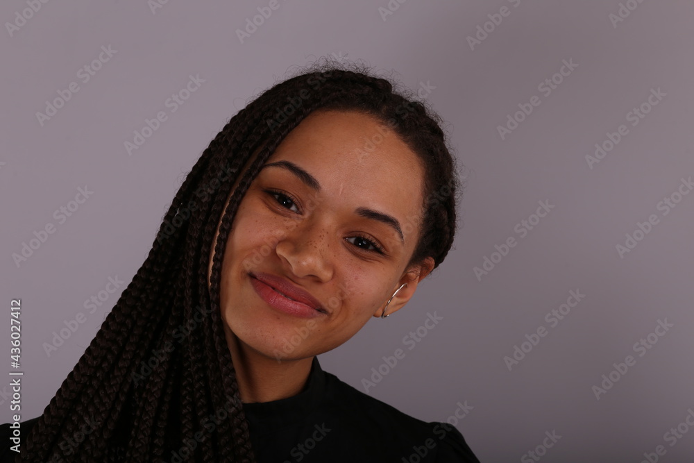 Beautiful smiling young woman on grey background Beautiful smiling young woman on grey background