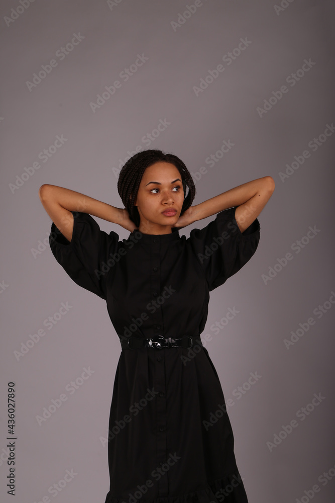 Portrait of beautiful curly woman in black dress Portrait of beautiful curly woman in black dress