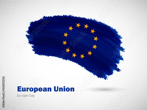 Happy europe day of European Union with artistic watercolor country flag background. Grunge brush flag illustration