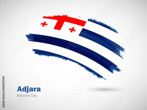 Happy national day of Adjara with artistic watercolor country flag background. Grunge brush flag illustration