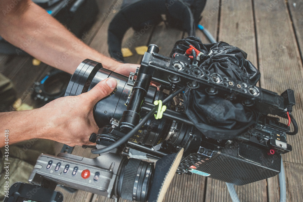 Professional film and video camera on the set. Shooting shift, equipment and group. Modern photography technique. Professional film and video camera on the set. Shooting shift, equipment and group. Modern photography technique.