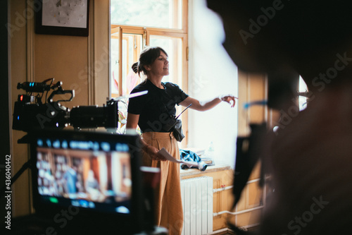 Director at work on the set. The director works with a group or with a playback while filming a movie photo