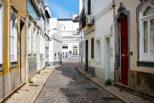 Narrow street of historic fishermen's town of Olhao, Algarve, Portugal
