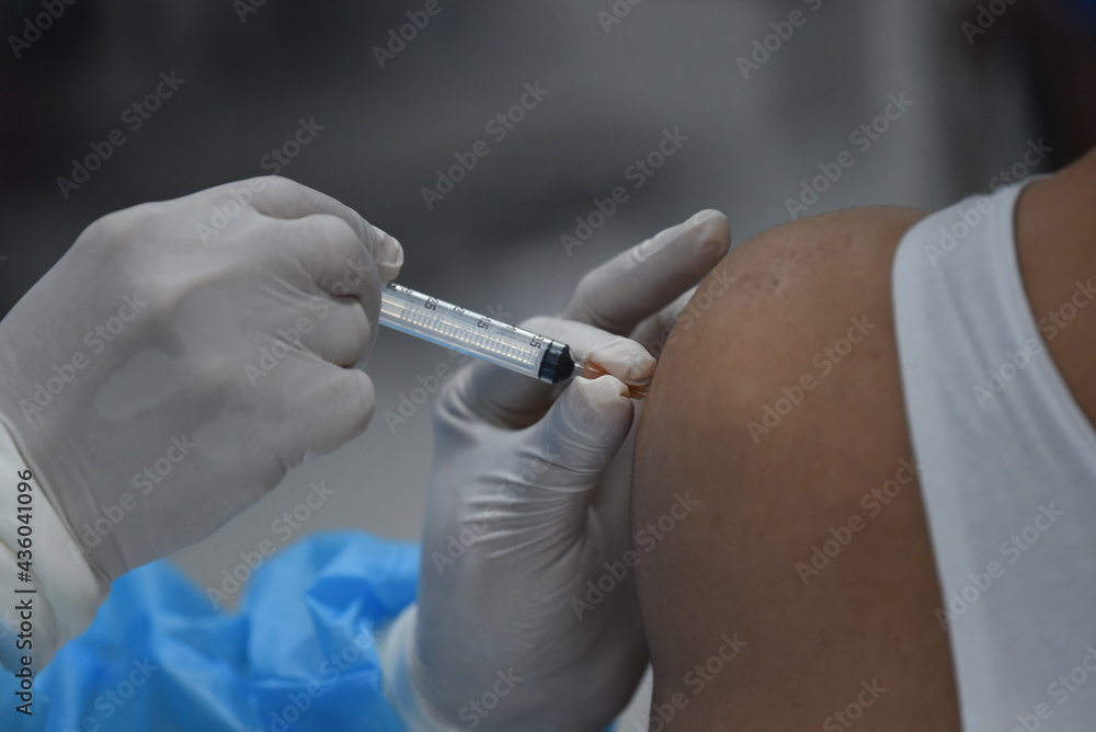 Thailand - Medical staff Are using a vaccine needle against COVID-19 To the people Who came to receive the vaccination At Bang Sue Central Railway Station on May 26, 2021. Thailand - Medical staff Are using a vaccine needle against COVID-19 To the people Who came to receive the vaccination At Bang Sue Central Railway Station on May 26, 2021.