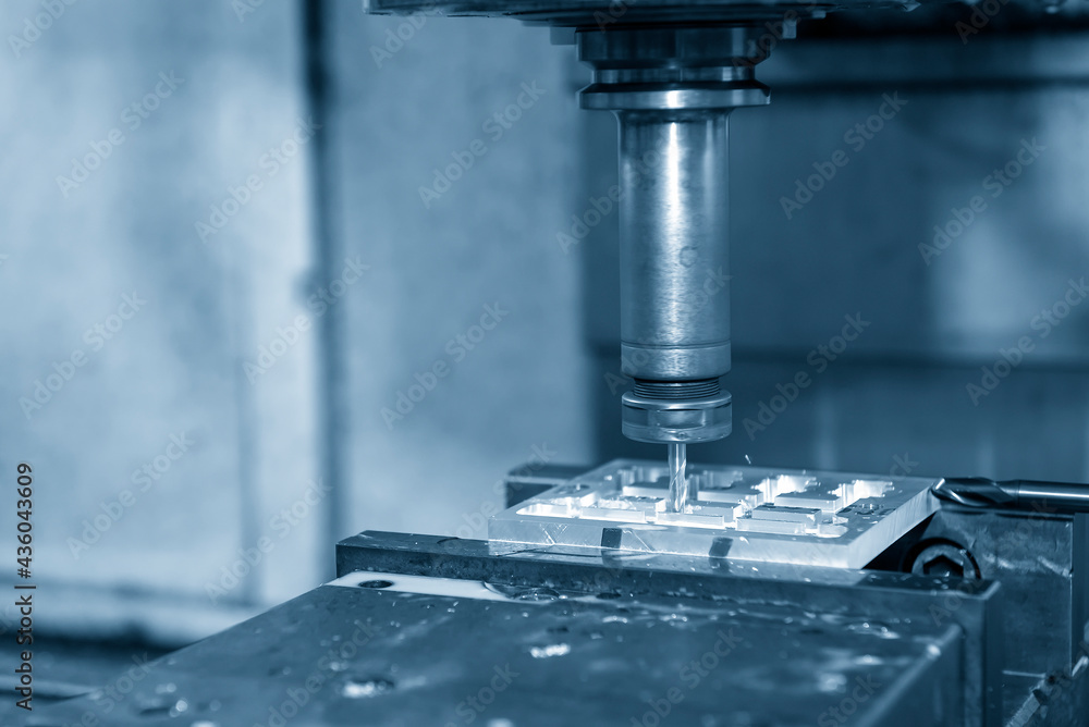 The CNC milling machine cutting the jig and fixture parts by solid end-mill tool type. The hi-precision mold and die manufacturing concept by machining center. The CNC milling machine cutting the jig and fixture parts by solid end-mill tool type. The hi-precision mold and die manufacturing concept by machining center.