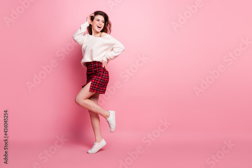Fototapeta Naklejka Na Ścianę i Meble -  Full body profile side photo of young attractive girl happy positive smile look empty space isolated over pink color background