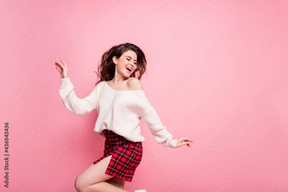 Profile side photo of young attractive girl happy positive smile look empty space isolated over pink color background Profile side photo of young attractive girl happy positive smile look empty space isolated over pink color background