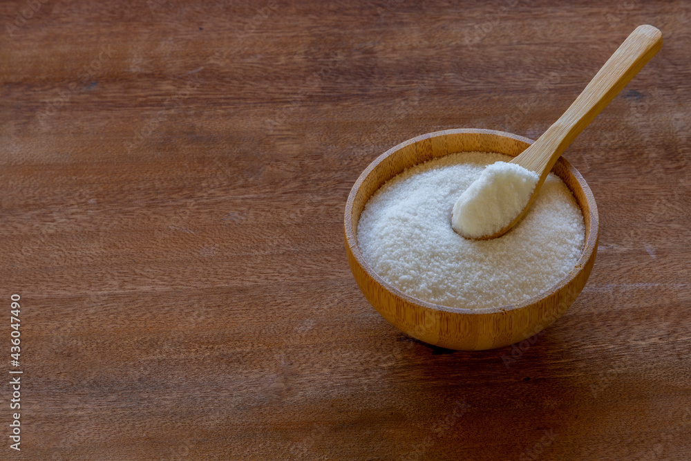 bamboo bowl with caster sugar on rustic wooden board. health concept. avoid sugar. space for text bamboo bowl with caster sugar on rustic wooden board. health concept. avoid sugar. space for text